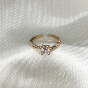 dhaneira’s gold tone ring